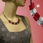 Preview: Kette Schrägperle Kunststoff rot-kristall-transparent Vollgummi schwarz 45cm