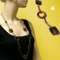 Preview: Kette Ringe Vierecke Kunststoff braunton Alu-Kette kupferfarben 90cm