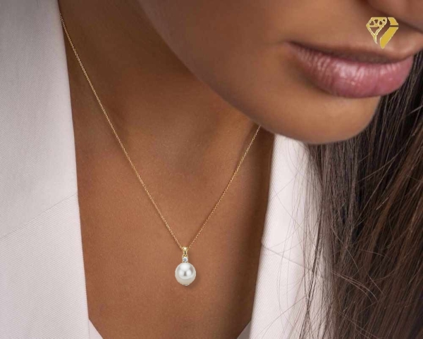 Anhänger mit Süßwasserzuchtperle 13x10mm und Zirkonia 8Kt 333 GOLD